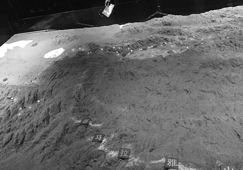 Figure 6. Raised relief map of Zhang Qian’s Central Asian journeys. Lightbulbs at the top of the map mark the progress of his journey. The characters on the bottom mark the Himalayas. Credit: photo by author.